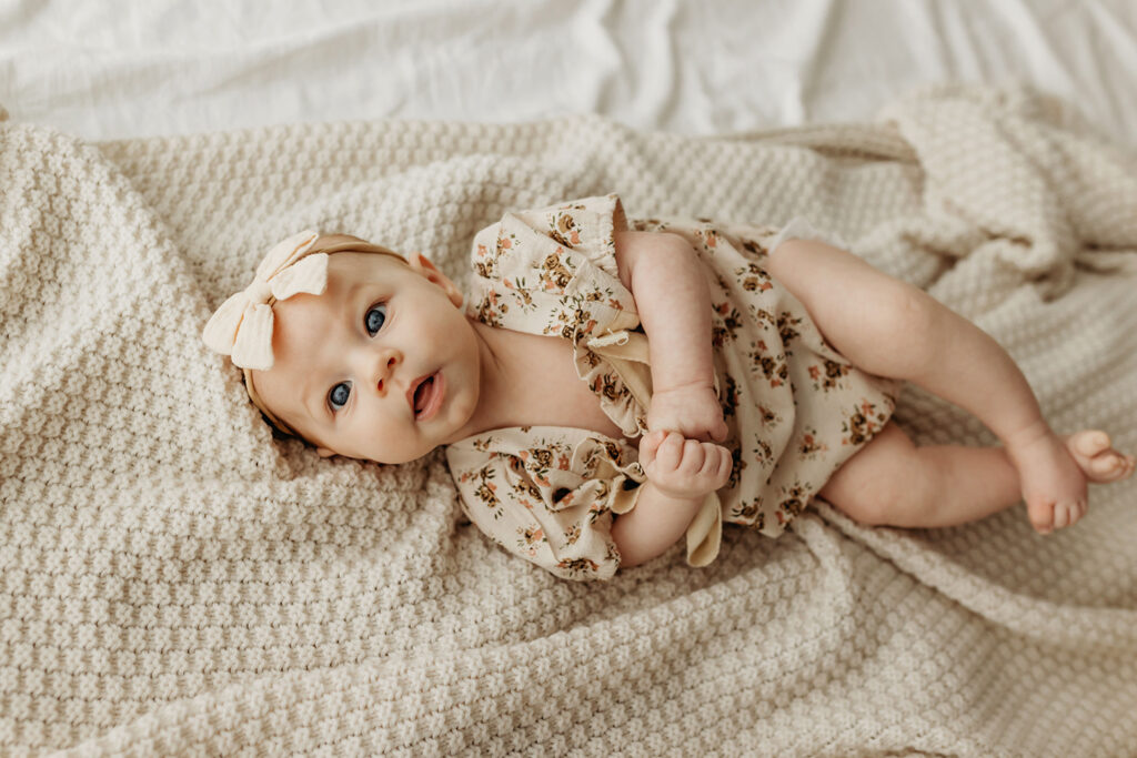 Portland Oregon baby photographer baby lying on bed