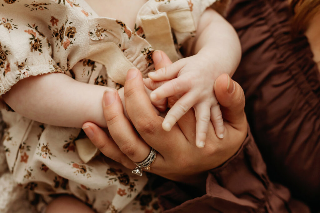 baby and mom hold hands Vancouver Washington baby photographer