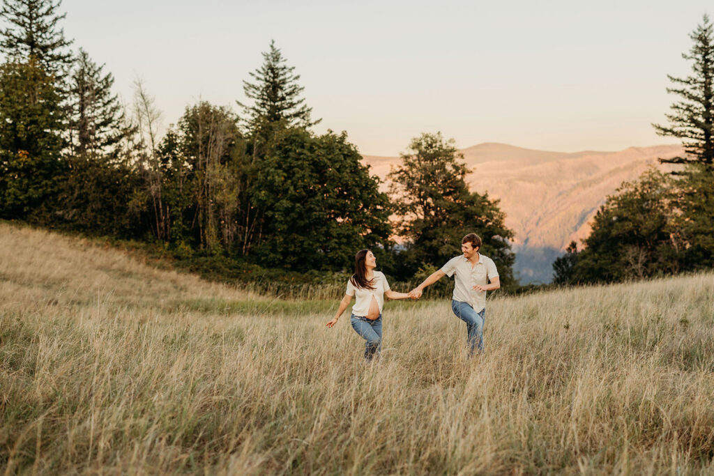 playful maternity session with couple outdoors Columbia River Gorge Vancouver Wa