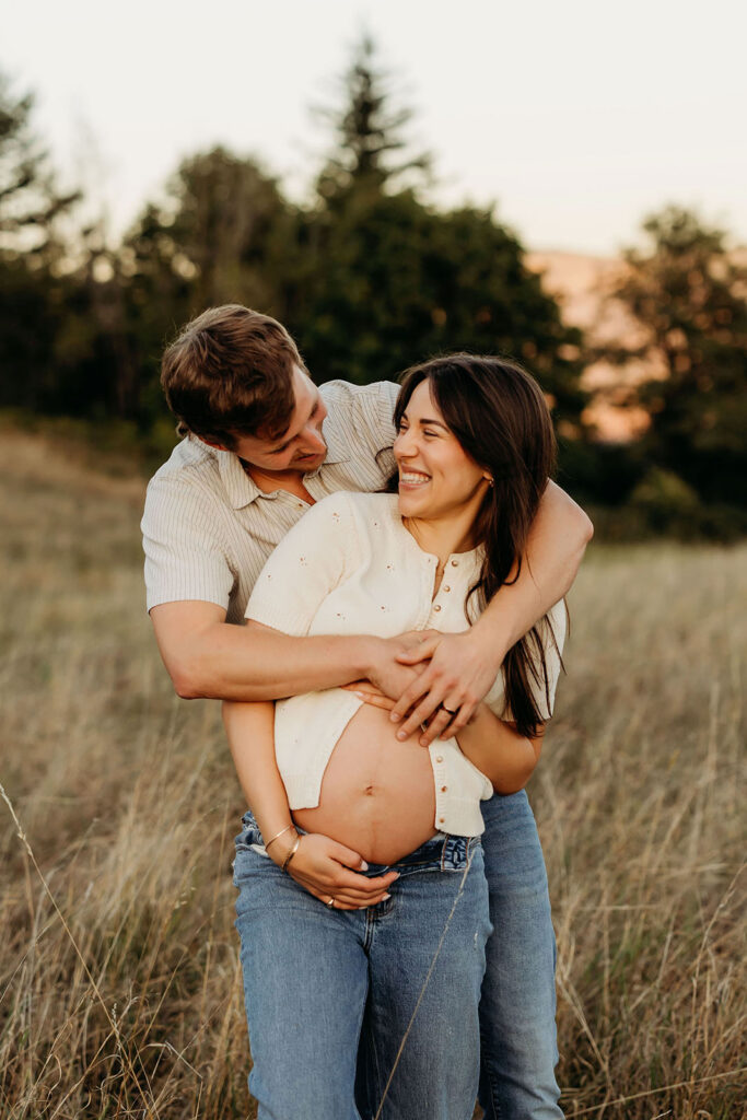 playful maternity session with couple outdoors Columbia River Gorge Vancouver Washington
